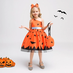 Detail of girl's Halloween pumpkin costume with satin dress, mesh hem, and matching headband