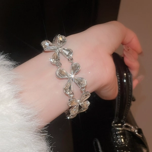 Detailed view of silver crystal bracelet with teardrop stones on wrist