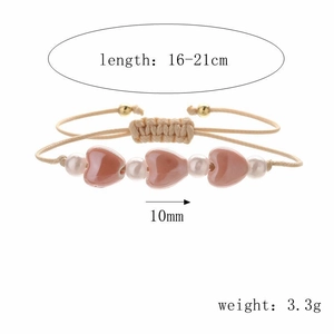 Bracelet fait main en corde beige avec cœurs en céramique et perles ajustables
