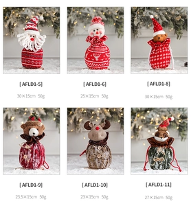 Detail of assorted Christmas drawstring gift bags with Santa and snowman designs