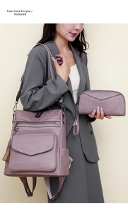 Detail view of purple textured faux leather backpack with tassel and woven shoulder strap