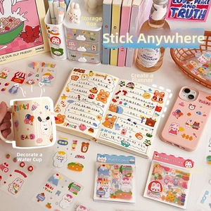 Detailed view of cute PET stickers with animals and desserts for DIY scrapbooking