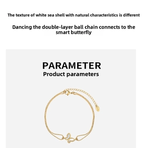 Detail of a double-layered 18K gold-plated anklet with white shell butterfly pendant
