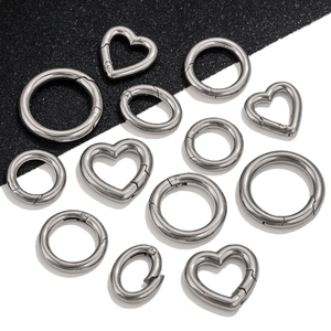 Polished stainless steel spring gate rings in heart, round, and oval shapes for DIY