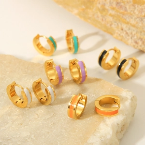 Macro view of colorful enamel and 18K gold plated stainless steel hoop earrings