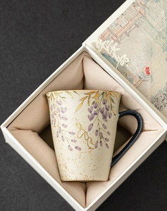Exquisite gift box macro view featuring hand-painted wisteria ceramic mug with gold detailing
