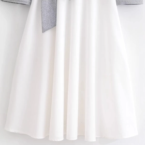 Fashionable grey and white patchwork skirt with elegant bow detail and soft knit fabric