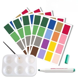 Art painting set with nylon brush, white plastic palette, and colorful watercolor samples