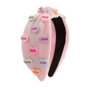 Pink plush knotted headband with colorful XOXO heart charms for Valentine's Day decor