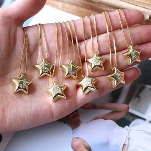 Elegant gold star initial necklace with sparkling cubic zirconia on a snake chain link