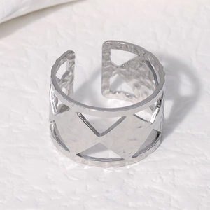Adjustable silver stainless steel ring with hammered texture and geometric hollow design