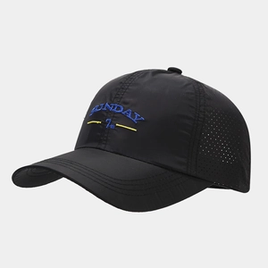 Close-up of breathable laser-cut holes and blue Sunday embroidery on black baseball cap