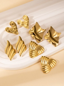 Detailed view of four pairs of 18K gold plated titanium steel earrings in unique shapes
