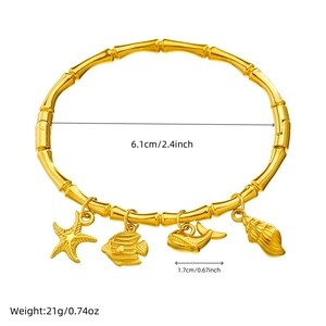 Golden bamboo style bracelet with sea charms including starfish and whale tail measurements