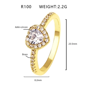 Detail view of heart-shaped gold ring with AAA+ zircons and brass craftsmanship