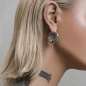 Polished silver heart hoop earrings in chunky dual-tone style for a modern look
