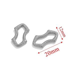 Detailed view of silver stainless steel textured oval connectors with 20mm x 12mm dimensions