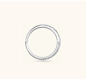 Close-up of silver hinged hoop earrings with pavé micro-inlaid zircon in minimalist style