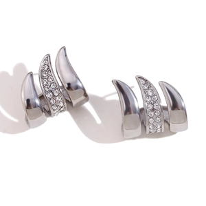 Modern silver three-prong earrings with sparkling white rhinestones on a white background
