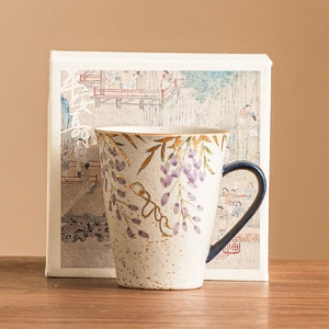 Ceramic mug with hand-painted wisteria and gold leaves, navy handle and premium gift box