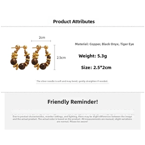 Detail view of vintage hoop earrings featuring tiger eye beads and copper beads with measurements