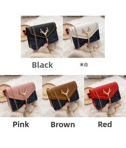 Detail view showing five stylish sequined crossbody bags with gold deer hardware