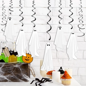 Halloween ghost hanging decorations with black foil spirals against a white brick wall