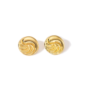 Detailed close-up of golden spiral relief earrings with a high-shine metallic texture