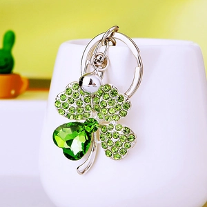 Sparkling green crystal four-leaf clover keychain with silver metal and rhinestones