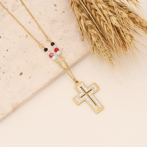 Golden butterfly heart necklace with cross pendant and colorful beads on stone base