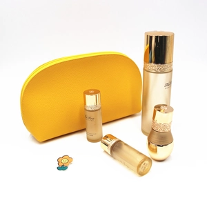 Litchi pattern yellow leather makeup bag with luxury gold skincare set on white background