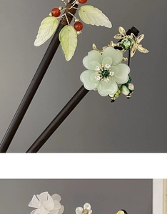Detail of Chinese hair sticks featuring jade leaves, shell flowers and beaded tassels