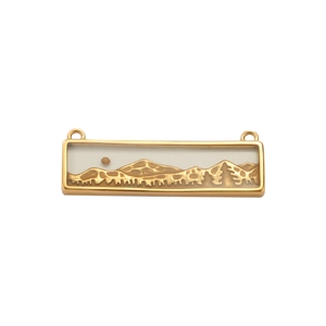 Detail of a rectangular golden stainless steel pendant with mountain relief engraving
