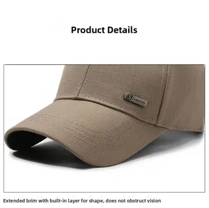 Detail of tan baseball cap featuring S FASHION metal logo and woven fabric texture