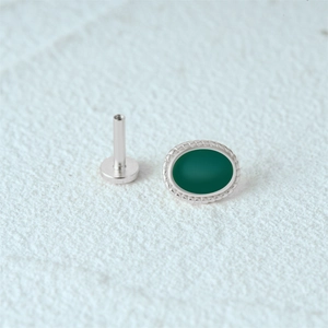 Macro shot of silver S925 stud with oval green stone and flat back screw post