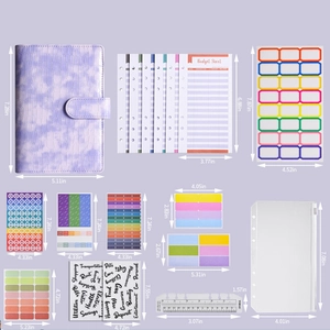 Detail view of A6 budget binder set with purple crocodile texture and various accessories