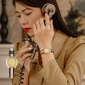 Elegant vintage lady quartz watch with gold octagonal case and plaid fabric strap