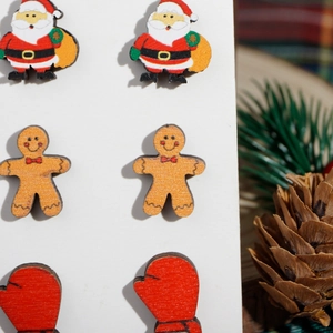 Detailed view of Christmas wooden stud earrings set featuring Santa and Gingerbread Man