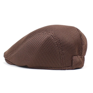Side view detail of breathable brown mesh fabric on a stylish summer beret hat