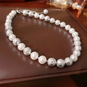 Elegant faux pearl necklace with silver textured beads and metal extension chain