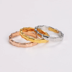 Three elegant bamboo joint rings in rose gold, gold, and silver finishes on white background