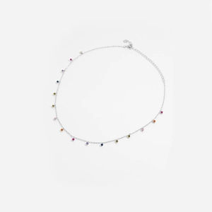 Close-up of silver necklace with colorful zircon pendants and adjustable chain clasp