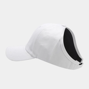 Detailed side view of a white ponytail baseball cap featuring a large rear opening cutout