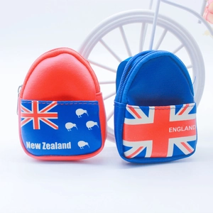 Detail of mini backpack keychains with British and New Zealand flag patterns on PU leather