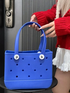 Detailed close-up of blue EVA beach tote bag featuring decorative strap fasteners