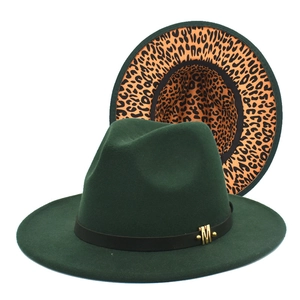 Detail of dark green fedora with leopard print lining and gold metal M buckle