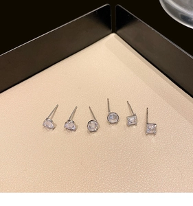 Detailed view of 925 silver stud earrings set featuring zircon heart and geometric shapes