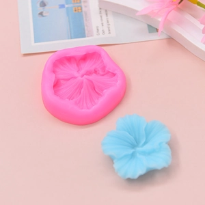 Macro shot of hibiscus flower silicone mold showing detailed petal textures for DIY cakes