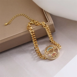 Macro shot of gold Cuban chain bracelet with zircon girl pendant on brown leather box