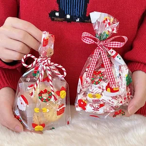 Christmas clear gift bags with Santa patterns and festive bows for candies and snacks